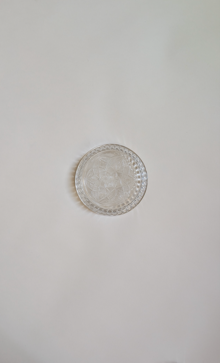 Dessous de bouteille en verre