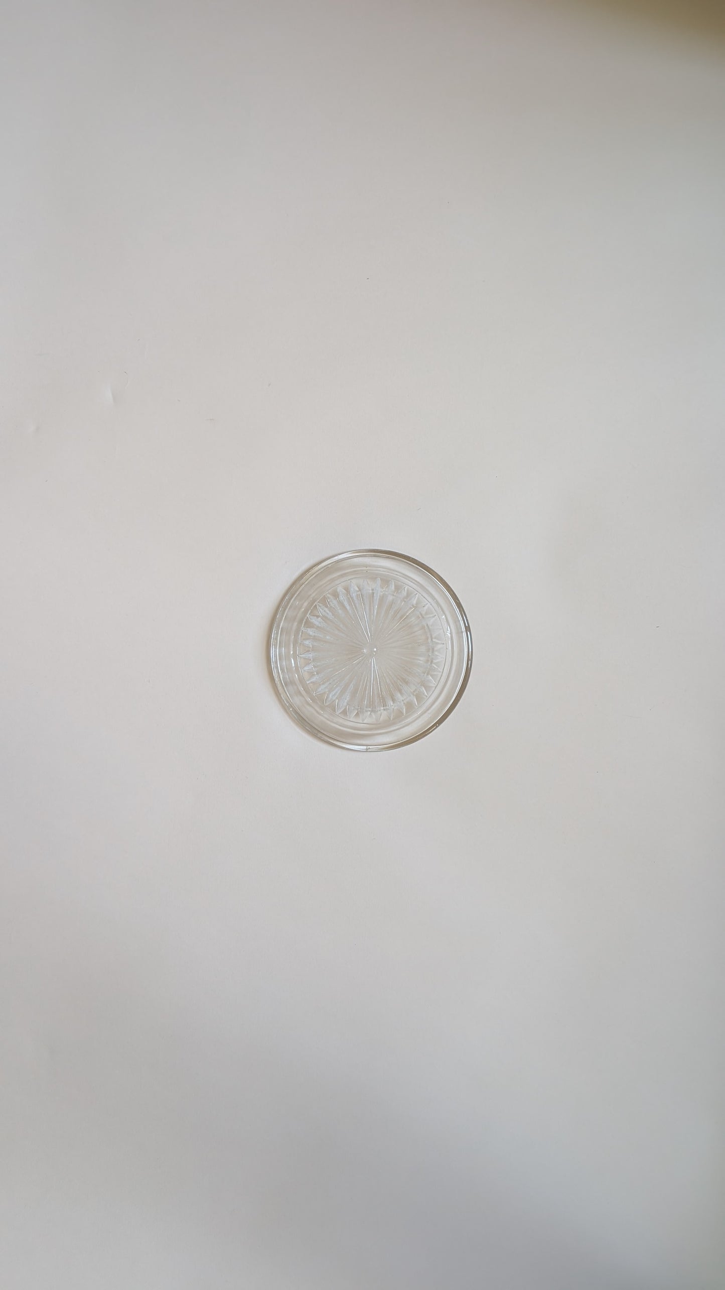 Dessous de bouteille en verre