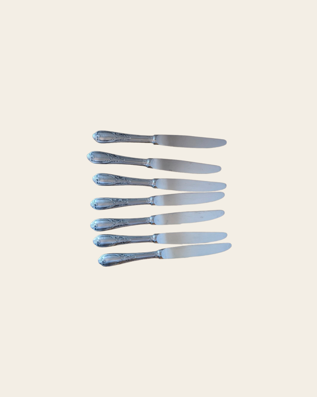 Ensemble de 7 couteaux en métal argenté