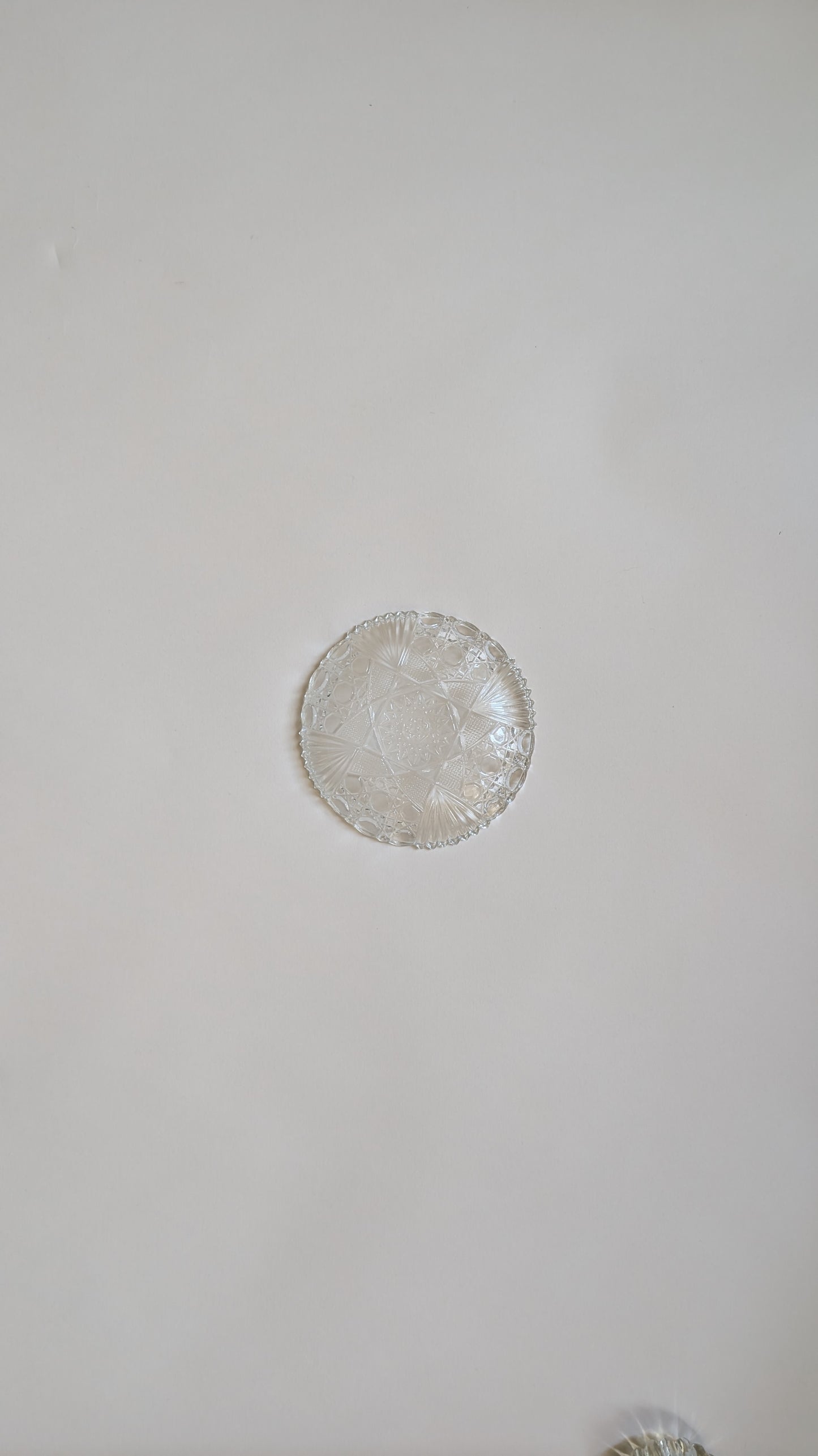Dessous de bouteille en verre