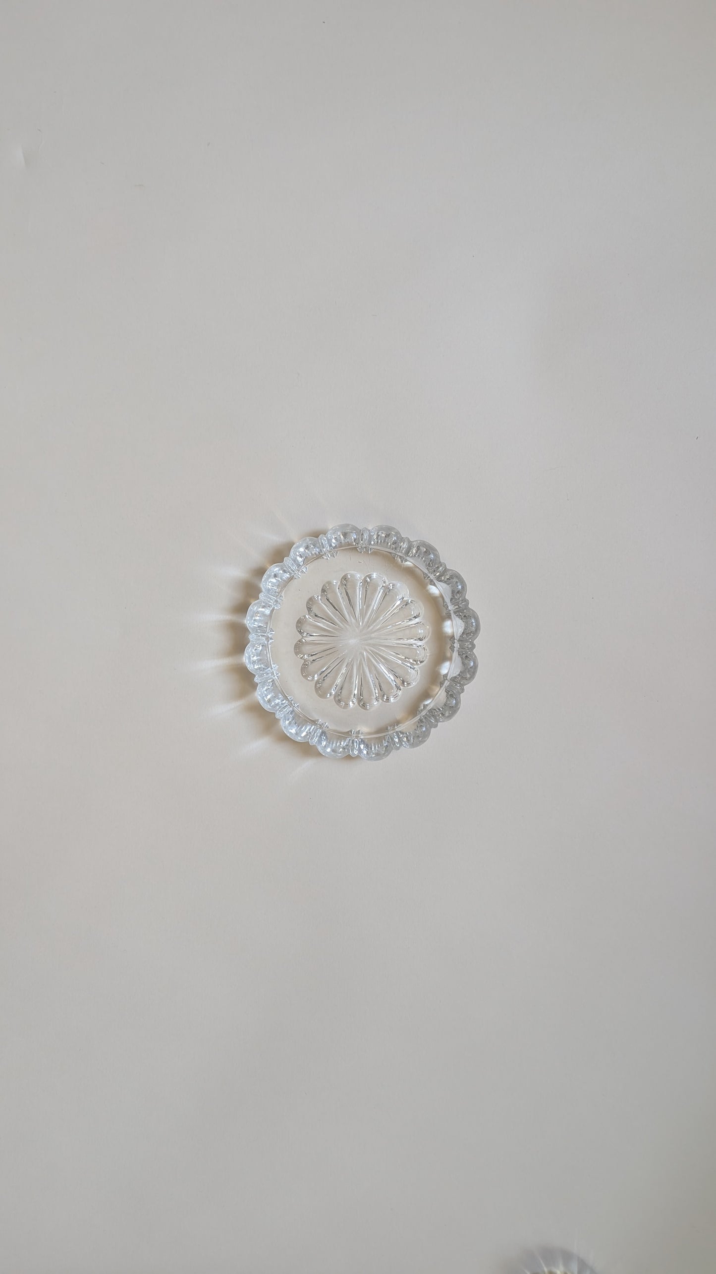 Dessous de bouteille en verre