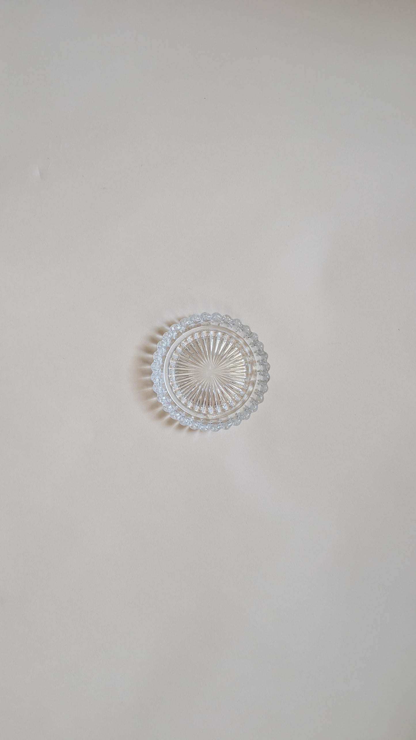 Dessous de bouteille en verre