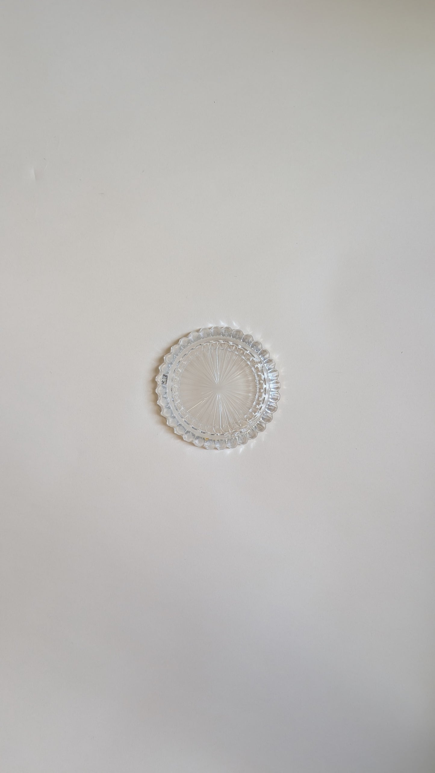 Dessous de bouteille en verre