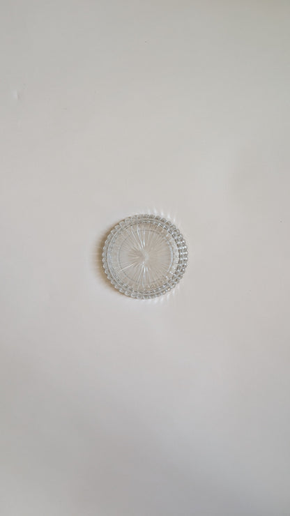 Dessous de bouteille en verre