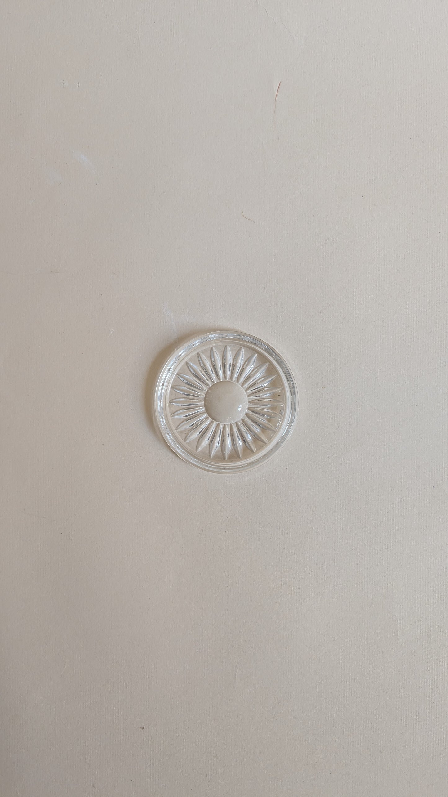 Dessous de bouteille en verre moulé
